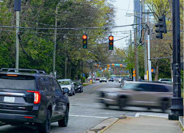 A car is moving very fast on the street.